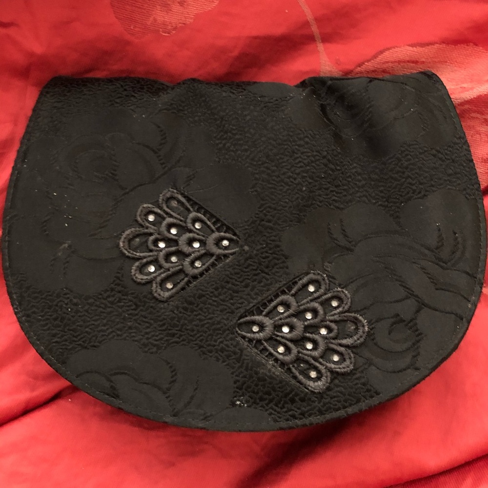 Stuart Weitzman satin clutch. Very feminine look.